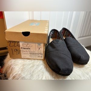 Black Toms size 7 women worn about 4xs
